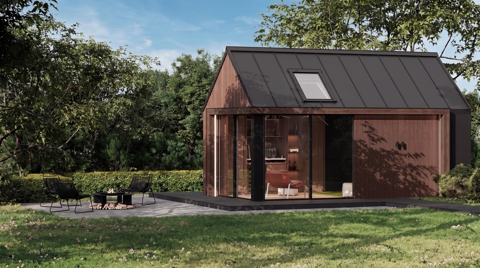 Skalva wood-clad garden room with glass doors, surrounded by a green garden